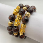 RED TIGER EYE BRACELET W/ GOLD PLATED PIXIU AND BEADS - 14MM