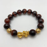 RED TIGER EYE BRACELET W/ GOLD PLATED PIXIU AND BEADS - 14MM