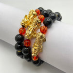 BLACK ONYX W/ GOLD PLATED PIXIU AND RED BEAD - 10MM